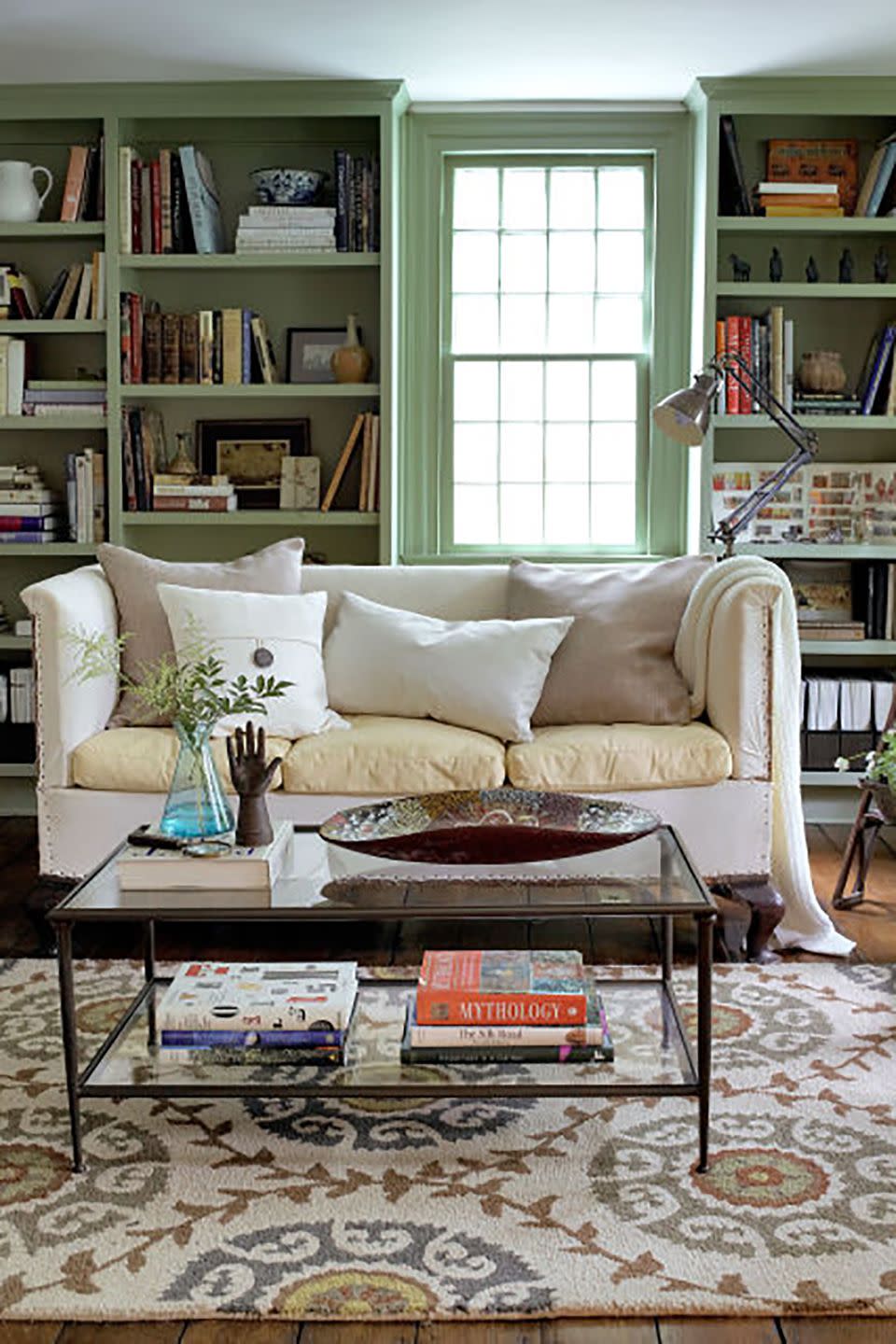 living room with green bookshelves