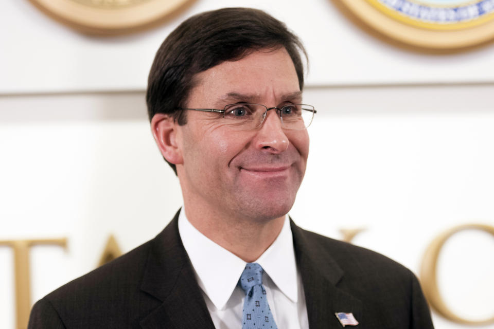 FILE - In this Nov. 6, 2019, file photo, U.S. Defense Secretary Mark Esper talks to the media with Qatar Deputy Prime Minister and Minister of Defense Khalid Al Attiyah at the Pentagon in Washington. Esper will visit Vietnam and meet with his Chinese counterpart in Thailand during a trek through Asia aimed at illustrating seriousness of the perceived threat to U.S. interests from Beijing. (AP Photo/Cliff Owen, File)