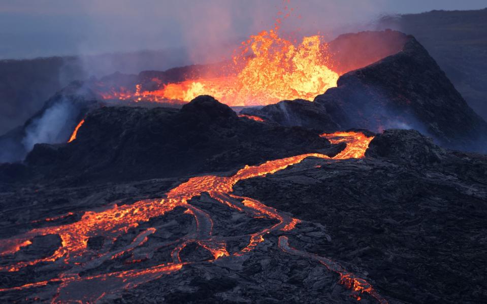 A volcano spews molten lava near Grindavik, Iceland in 2021