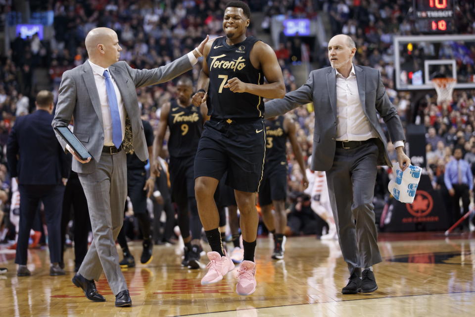 Toronto Raptors guard Kyle Lowry (7) limps off the court during the first half of the team's NBA basketball game against the Washington Wizards on Friday, Jan. 17, 2020, in Toronto. (Cole Burston/The Canadian Press via AP)