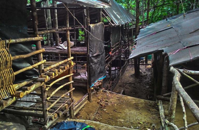 An abandoned migrant detention camp used by people-smugglers is seen in a jungle near the Malaysia-Thailand border, in Genting Perah