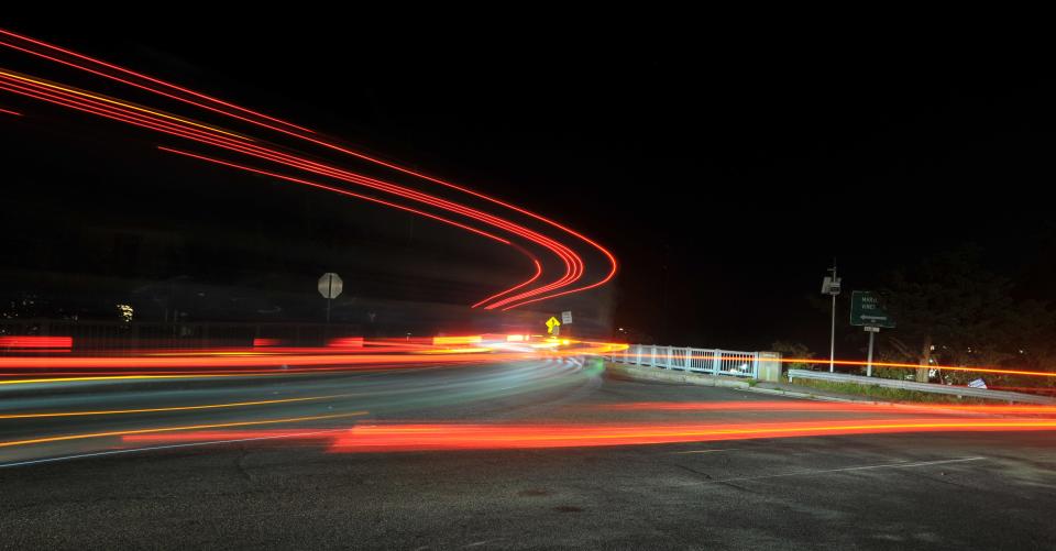 A truck leaves a long streak of red from its rear lights in this long exposure during a turn on Sept. 6 onto Crane Street in Woods Hole, to enter the Woods Hole, Martha's Vineyard and Nantucket Steamship Authority's terminal area. The truck was waiting to board the M/V Governor for the 5:30 a.m. departure to Martha's Vineyard.