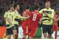 Manchester City's Erling Haaland, right, scuffles with Bayern's Leon Goretzka during the Champions League quarter final second leg soccer match between Bayern Munich and Manchester City, at the Allianz Arena stadium in Munich, Germany, Wednesday, April 19, 2023. (AP Photo/Matthias Schrader)