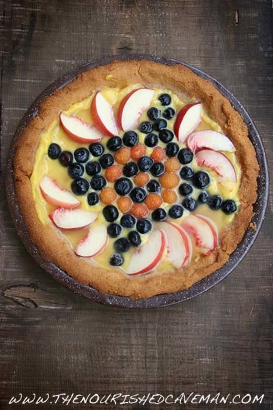 <p>The Nourished Caveman</p><p>Enjoy the fresh flavors of springtime with the delicious taste of this Fruit Tart filled with lemon curd and topped with fresh berries!</p><p><a href="https://thenourishedcaveman.com/keto-fruit-tart" rel="nofollow noopener" target="_blank" data-ylk="slk:Get the recipe!;elm:context_link;itc:0;sec:content-canvas" class="link ">Get the recipe!</a></p>