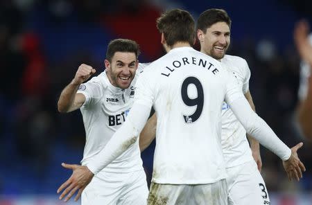 Britain Football Soccer - Crystal Palace v Swansea City - Premier League - Selhurst Park - 3/1/17 Swansea City's Fernando Llorente, Angel Rangel and Federico Fernandez celebrate after the game Reuters / Eddie Keogh Livepic