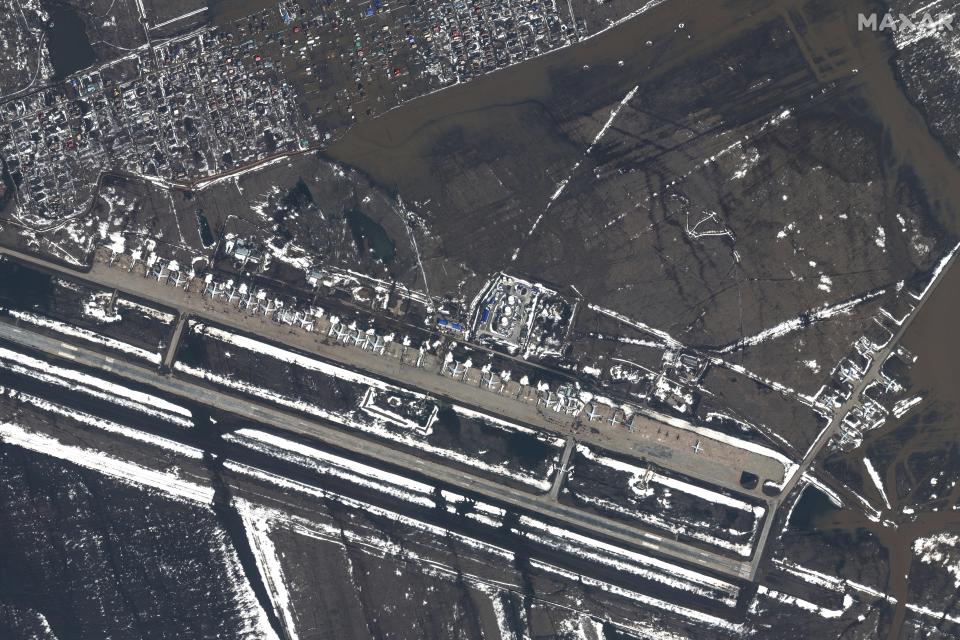 This image provided by Maxar Technologies, shows flooded areas of the airbase in Orenburg, Russia, Wednesday, April 3, 2024. State media say Russia's government has declared the situation in flood-hit areas in the Orenburg region a federal emergency. (Satellite image ©2024 Maxar Technologies via AP)