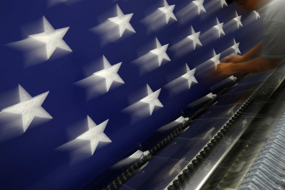 <p>A worker inspects a sheet of stars after embroidery at the FlagSource facility in Batavia, Illinois, U.S., on Tuesday, June 27, 2017. (Photo: Jim Young/Bloomberg via Getty Images) </p>