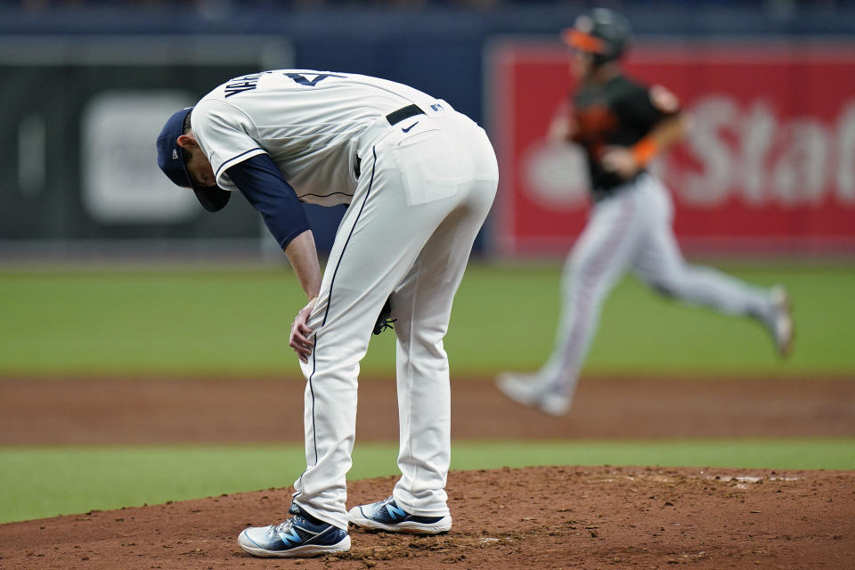 Tampa Bay Rays starting pitcher Ryan Yarbrough reacts after giving up a two-run home run to Baltimore Orioles' Trey Mancini during the third inning of a baseball game Friday, June 11, 2021, in St. Petersburg, Fla. (AP Photo/Chris O'Meara)