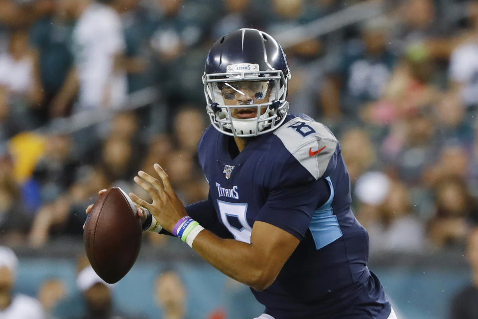 FILE - In this Aug. 8, 2019, file photo, Tennessee Titans quarterback Marcus Mariota (8) looks to pass during a preseason NFL football game against the Philadelphia Eagles in Philadelphia. The Titans are paying Mariota $20.9 million, and the No. 2 draft pick overall in 2015 will have to earn his next contract. He has yet to play a full 16-game season in the NFL and missed three starts last season, including the regular season finale with a playoff berth on the line for the winner. (AP Photo/Matt Rourke, File)