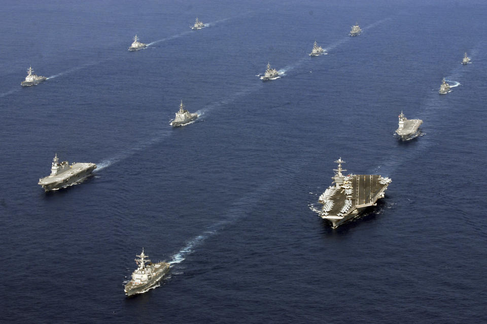 In this photo taken Nov. 16, 2012 and released by U.S. Navy, twenty-six ships from the U.S. Navy and the Japan Maritime Self-Defense Force, including USS George Washington, bottom right, steam together in East China Sea after the conclusion of Keen Sword, a biennial naval exercise by the two countries to respond to a crisis in the Asia-Pacific region. As U.S. President Barack Obama tours Asia to push his year-old pivot to the Pacific policy, the big question on everybody's mind is how much of a role Washington, with its mighty military and immense diplomatic clout, can play in keeping the Pacific. Japan is Washington's most faithful security partner in the Pacific and it is the most pinched by China's rise. (AP Photo/U.S. Navy, Chief Mass Communication Specialist Jennifer A. Villalovos) EDITORIAL USE ONLY