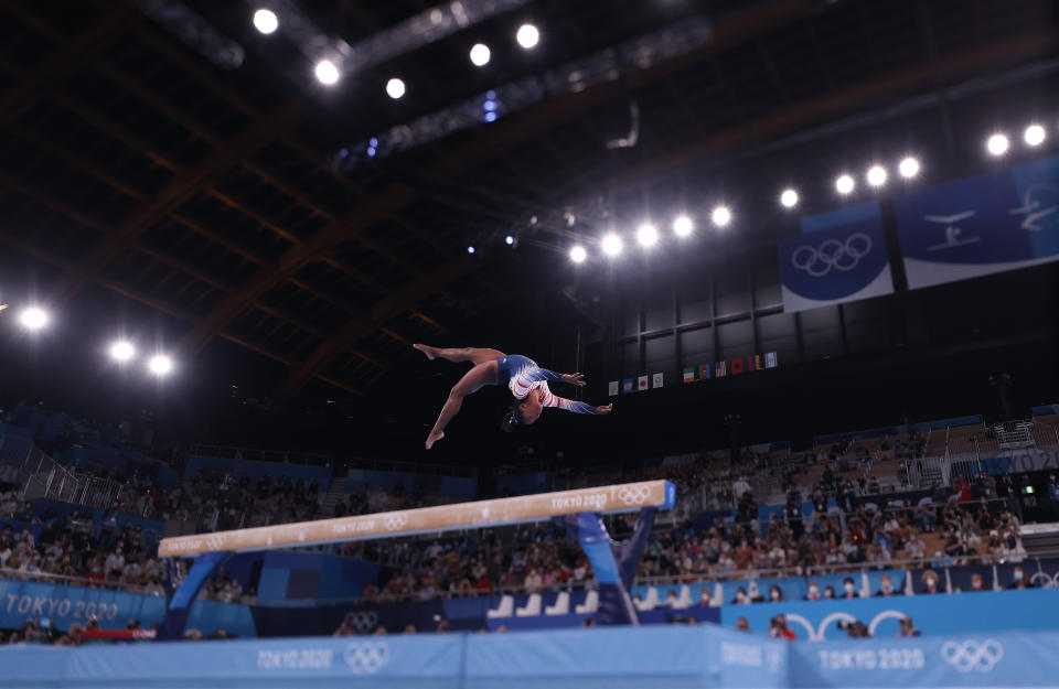 <p>TOKYO, JAPAN - AUGUST 03: (EDITORS NOTE: Image was created using a variable planed lens.) Simone Biles of Team United States in action during the Women's Balance Beam Final on day eleven of the Tokyo 2020 Olympic Games at Ariake Gymnastics Centre on August 03, 2021 in Tokyo, Japan. (Photo by Laurence Griffiths/Getty Images)</p> 