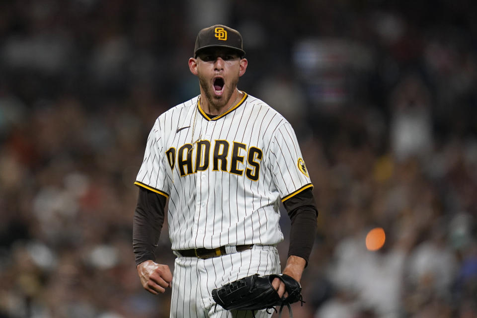 San Diego Padres starting pitcher Joe Musgrove reacts after an unassisted double play by first baseman Eric Hosmer during the seventh inning of the team's baseball game against the San Francisco Giants, Thursday, July 7, 2022, in San Diego.  Tommy La Stella lined out, and Brandon Crawford was doubled off first.  (AP Photo/Gregory Bull)