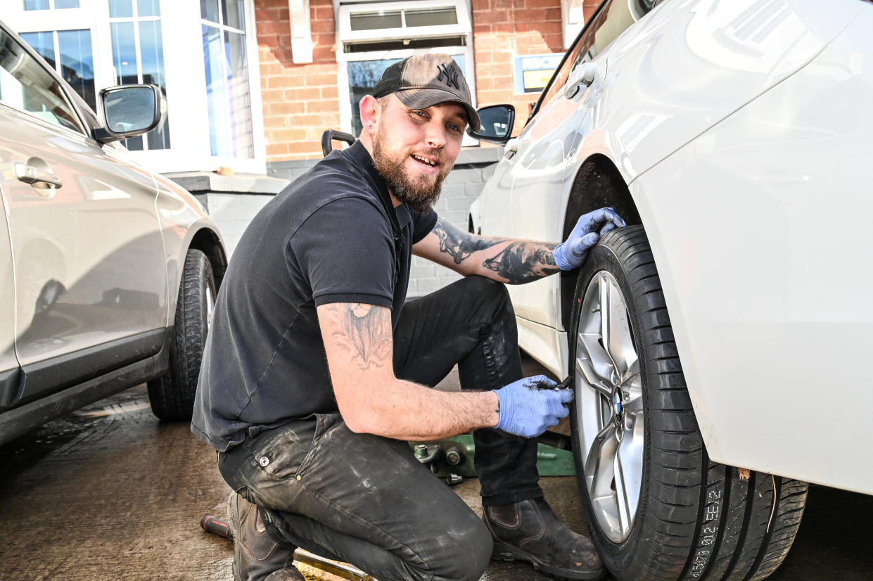 Jake Bow,29, tyre fitter from Hereford Tyres. Photo released February 4 2024.  See SWNS story SWLNpotholes. People living in the pothole capital of England say the roads are so bad itâ€™s like â€œdriving over the moonâ€. A study found Hereford had more potholes than any other area in the country â€“ with 25,000 being reported to the council last year alone. Data reviewed from reports on the FixMyStreet platform found there was one pothole reported for every 127th resident in Hereford. Locals even say the pavements are â€œfalling apartâ€ with some saying they are too scared to venture out after dark in case they trip over.
