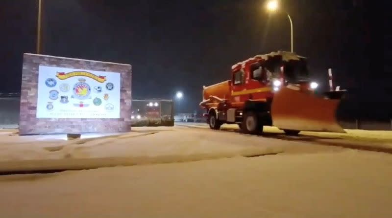 A vehicle of the Fourth Emergency Intervention Battalion (BIEM IV) drives on its way to collaborate with the emergency services deployed in Soria to rescue drivers trapped by heavy snowfall, near Zaragoza, Spain, January 19