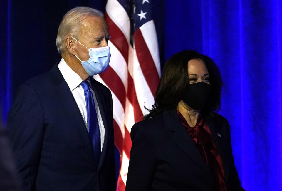 WILMINGTON, DELAWARE - NOVEMBER 06: Democratic presidential nominee Joe Biden and vice presidential nominee Sen. Kamala Harris (D-CA)  take the stage to address the nation at the Chase Center November 06, 2020 in Wilmington, Delaware.  The winner of the 2020 presidential election has yet to be declared, as vote counting continues in the key states of Pennsylvania, Georgia, Nevada, Arizona, and North Carolina. (Photo by Drew Angerer/Getty Images)