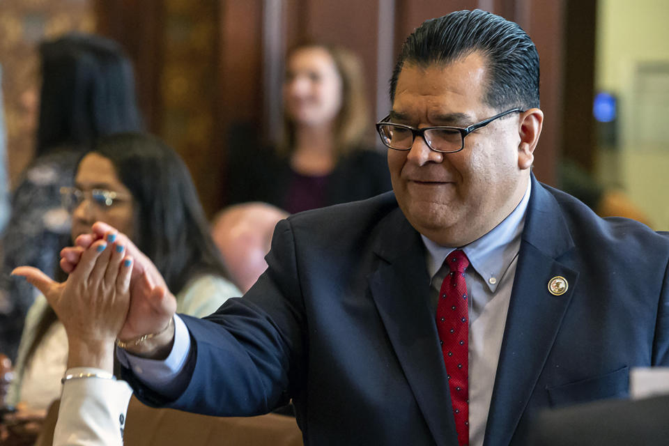 FILE - In this June 2, 2019 file photo Illinois State Sen. Martin Sandoval, D-Chicago, at the Illinois State Capitol, in Springfield, Ill. Even the normally unflappable speaker of the Illinois House Michael Madigan had to pause at the sight of FBI agents entering the Democratic side of the Capitol building this week and later hauling away containers of documents from a lawmaker's office. The Capitol raid Monday was at the office of state Sen. Martin Sandoval, who represents a southwest side Chicago district that overlaps with Madigan's district. (Justin L. Fowler/The State Journal-Register via AP File)