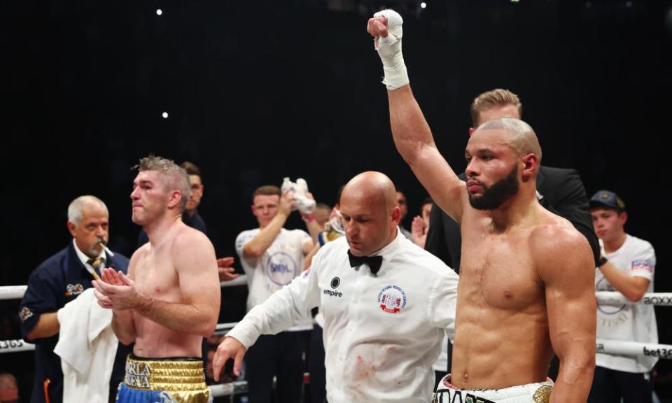 Chris Eubank Jr raises his hand in victory after being declared the winner against Liam Smith.