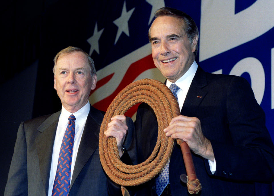 U.S. Senator Bob Dole (R) is presented a bullwhip April 12 by T. Boone Pickins (L), at a fund raising stop in Dallas two days into Dole's campaign for the U.S. presidency. Pickens said the whip was to help Dole get things done in Washington D.C - Reuters Images