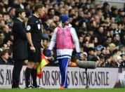 Chelsea's Diego Costa (R) walks along the touch line during the English Premier League match against Tottenham at White Hart Lane on November 29, 2015