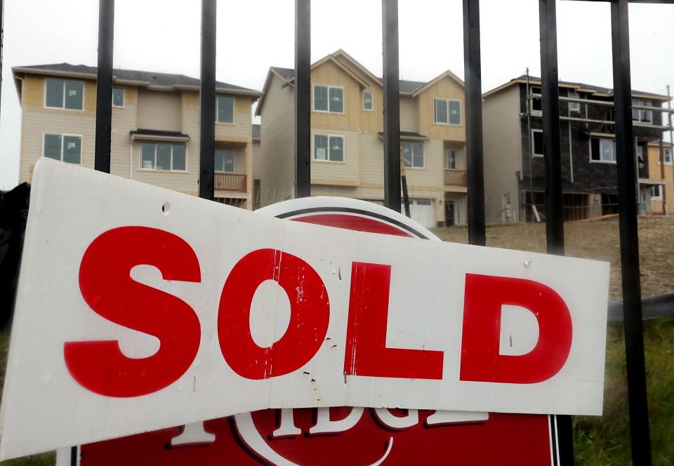 A sold sign adorns a home site at the Ridge development in Bremerton, Wash.