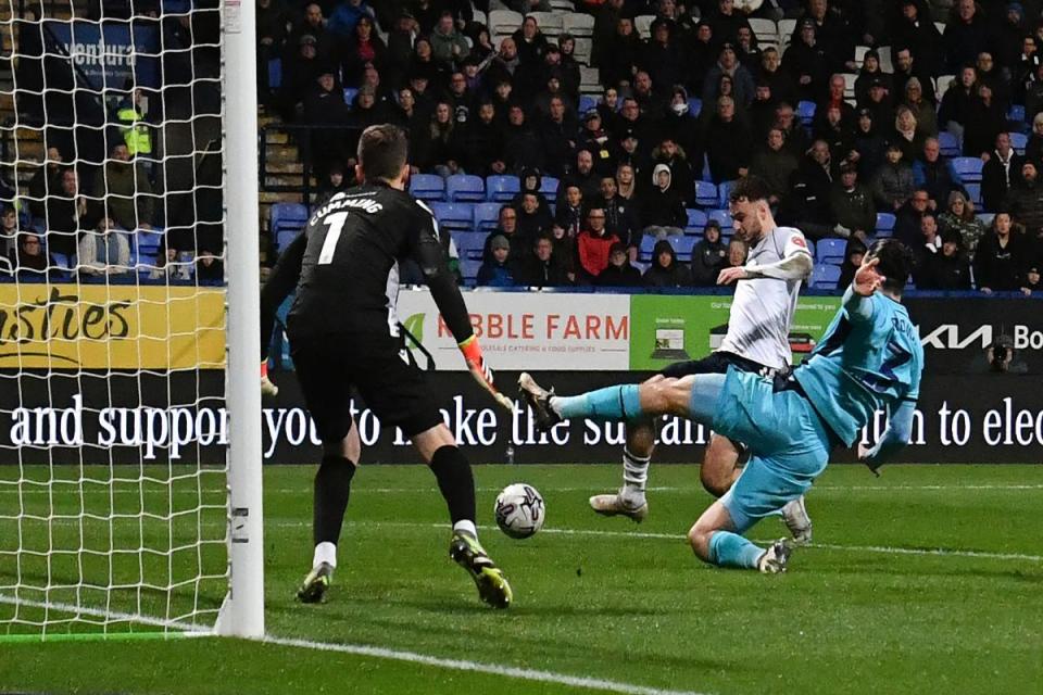 Aaron Collins slots home against Oxford <i>(Image: Camerasport)</i>