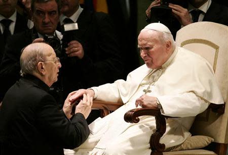 Pope John Paul II (R) blesses Father Marcial Maciel, founder of the Legionaries of Christ, during a special audience in Paul VI hall at the Vatican November 30, 2004 file photo. REUTERS/Tony Gentile