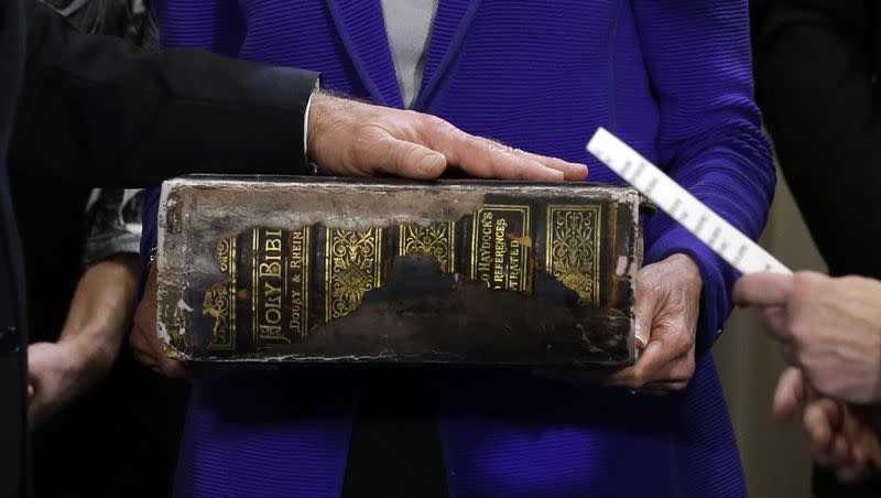 Then Vice President Joe Biden, left, places his hand on the Biden Family Bible held by his wife Jill Biden, center, as he takes the oath of office from Supreme Court Justice Sonia Sotomayor, right, during and official ceremony at the Naval Observatory onJan. 20, 2013, in Washington.