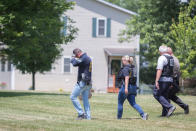 <p>Police investigators are seen outside the house of Virginia shooting suspect James Hodgkinson in Belleville, Ill., June 14, 2017. (Photo: Kenny Bahr/Reuters) </p>