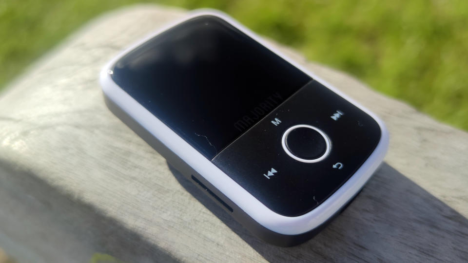 The Majority MP3 Player on a wooden bench.