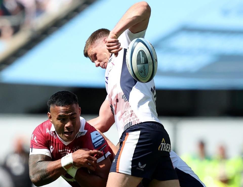 Manu Tuilagi of Sale Sharks has the ball ripped by Owen Farrell of Saracens in the tackle - Jan Kruger/Getty Images for Sale Sharks