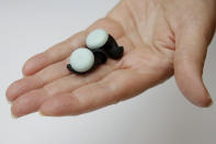 In this Tuesday, Sept. 24, 2019, photo Ivy Ross holds Pixel buds at Google in Mountain View, Calif. (AP Photo/Jeff Chiu)