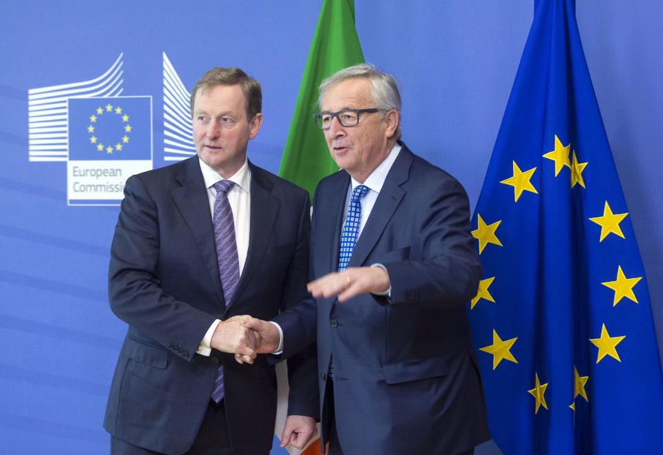 European Commission President Jean-Claude Juncker, right, speaks with Irish Prime Minister Enda Kenny prior to a meeting at EU headquarters in Brussels on Thursday, Feb. 23, 2017. (AP Photo)