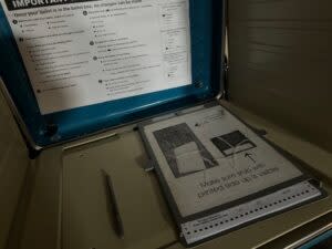  “I voted in the dark” stickers weren’t available at this central Omaha polling place. but voters were doing just that for a while during a morning power failure. (Aaron Sanderford/Nebraska Examiner)