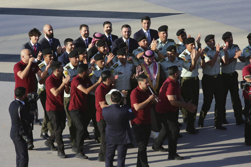 Jordan's Crown Prince Hussein, center, participates in a celebration in Amman, Jordan, Wednesday, May 31, 2023, a day before his wedding to Saudi architect Rajwa Alseif. (AP Photo/Raad Adayleh)