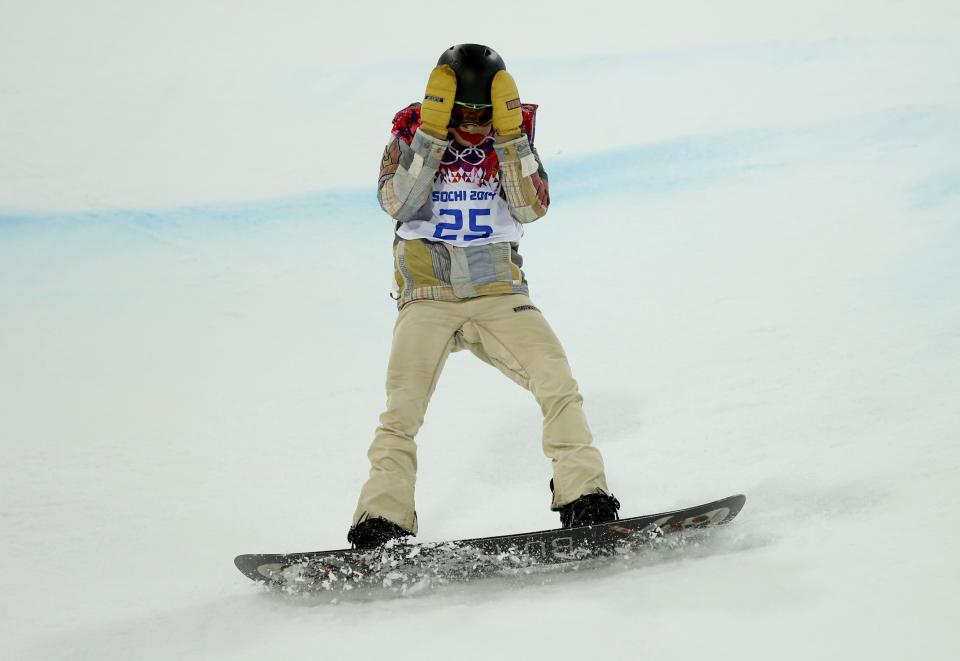 Shaun White of the U.S. reacts after crashing during the men's snowboard halfpipe final event at the 2014 Sochi Winter Olympic Games, in Rosa Khutor February 11, 2014. REUTERS/Mike Blake (RUSSIA - Tags: TPX IMAGES OF THE DAY SPORT OLYMPICS SPORT SNOWBOARDING)