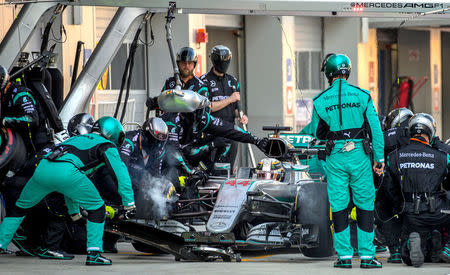 Formula One - Russian Grand Prix - Sochi, Russia - 1/5/16 - Mercedes Formula One driver Lewis Hamilton of Britain sits in a car at the pit lane during the race. REUTERS/Srdjan Suki/Pool