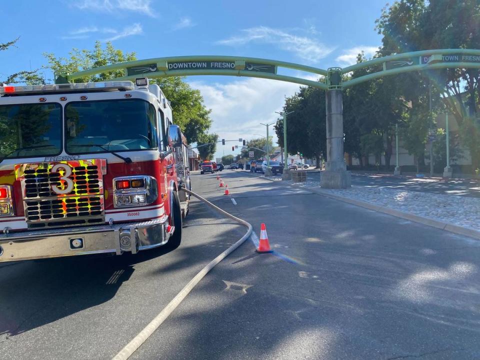 A fire truck blocks Tulare Street near Highway 41 after a fire on the embankment of the southbound lanes near downtown Fresno, California, on Monday, July 24, 2023.