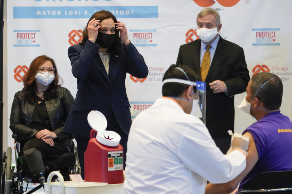 Vice President Kamala Harris talks with Lucio Polanco, a high-rise window washer, as he gets the Johnson & Johnson COVID-19 vaccination from Osman Meah at COVID-19 vaccination site, Tuesday, April 6, 2021, in Chicago. Watching are Sen. Tammy Duckworth, D-Ill., left, and Sen. Dick Durbin, D-Ill. The site is a partnership between the City of Chicago and the Chicago Federation of Labor. (AP Photo/Jacquelyn Martin)