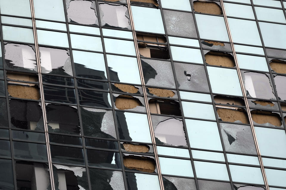 Blown out windows on a high-rise downtown building are shown in the aftermath of a severe thunderstorm Friday, May 17, 2024, in Houston. Thunderstorms pummeled southeastern Texas on Thursday killing at least four people, blowing out windows in high-rise buildings and knocking out power to more than 900,000 homes and businesses in the Houston area. (AP Photo/David J. Phillip)