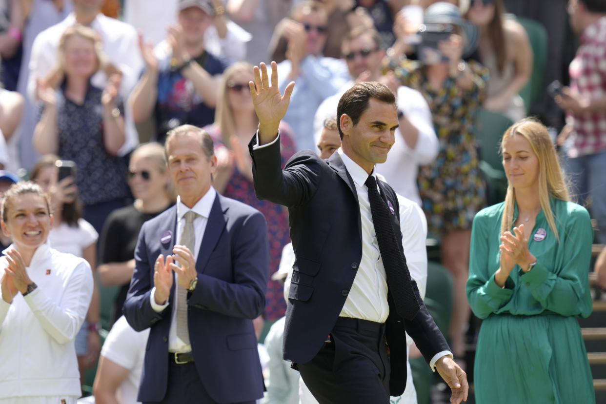 FILE - Switzerland's Roger Federer waves during a 100 years of Centre Court celebration on day seven of the Wimbledon tennis championships in London, on July 3, 2022. Federer announced Thursday, Sept. 15, 2022 he is retiring from tennis. (AP Photo/Kirsty Wigglesworth, File)