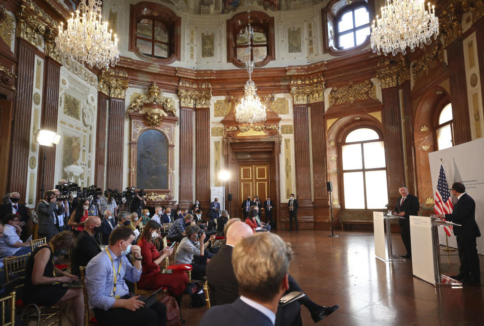 U.S. Secretary of State Mike Pompeo holds a joint news conference with Austrian Foreign Minister Alexander Schallenberg, right, in Vienna Austria, Friday Aug. 14, 2020. Pompeo is on a five-day visit to central Europe. (Lisi Niesner/Pool via AP)