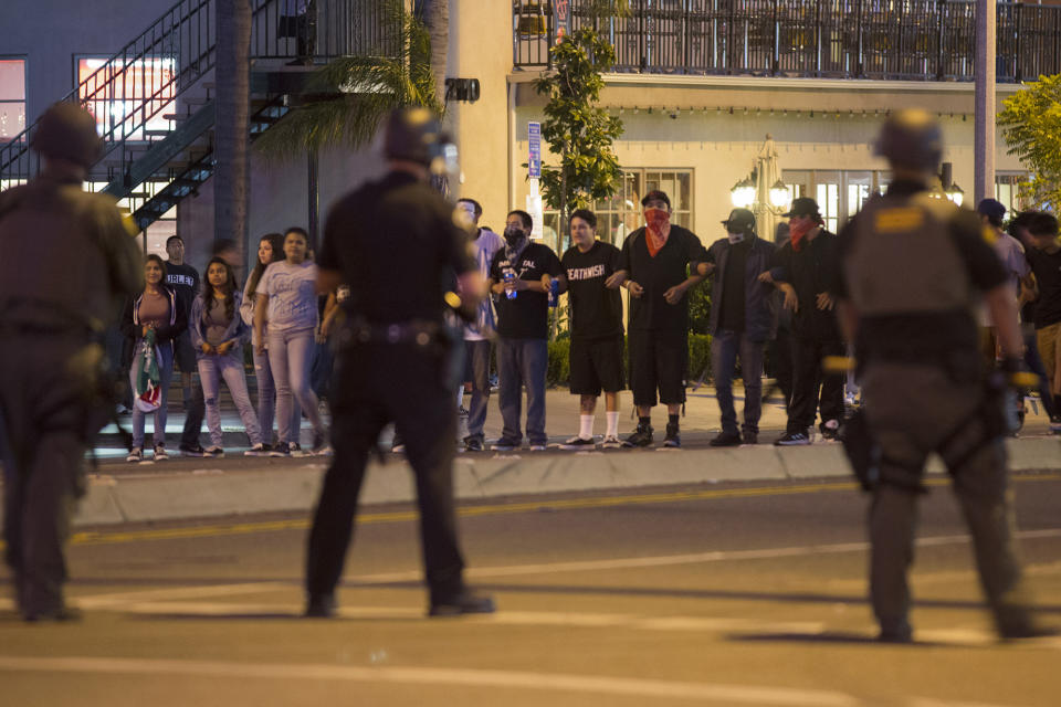 <p>Protesters lock arms as police prepare to make mass arrests after a campaign rally by presumptive GOP presidential candidate Donald Trump at the Anaheim Convention Center on May 25, 2016, in Anaheim, Calif. (David McNew/Getty Images) </p>