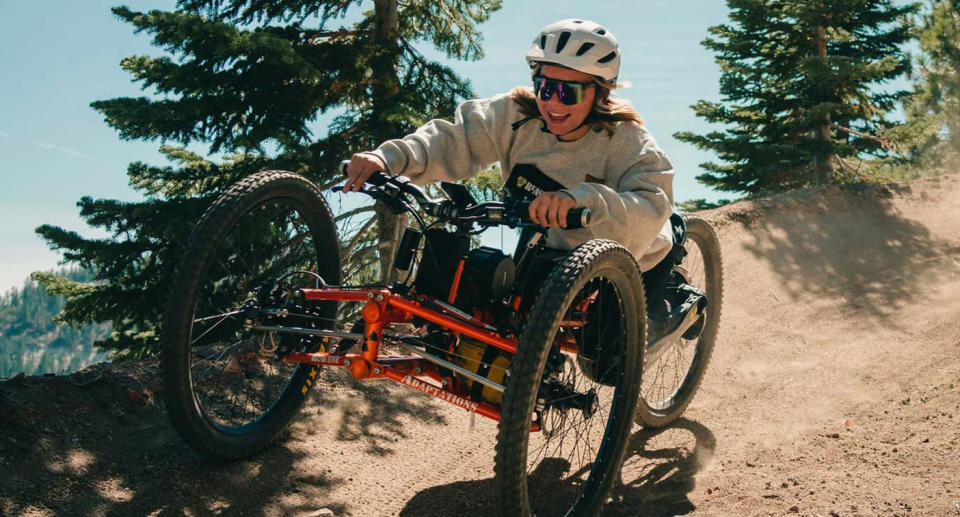 Cassie Eckroth riding on a three-wheeled bike.