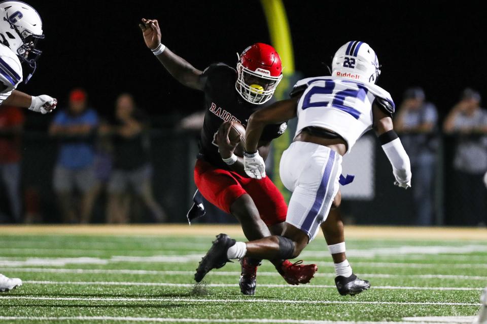 Zo Smalls looks for running room in a game against Calvary Day on Sept. 22, 2023.