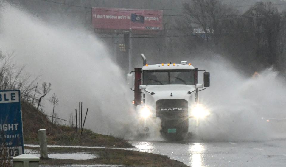 A truck drives through standing water on State Highway 28 Bypass in Anderson, S.C. Tuesday, January 9, 2024.