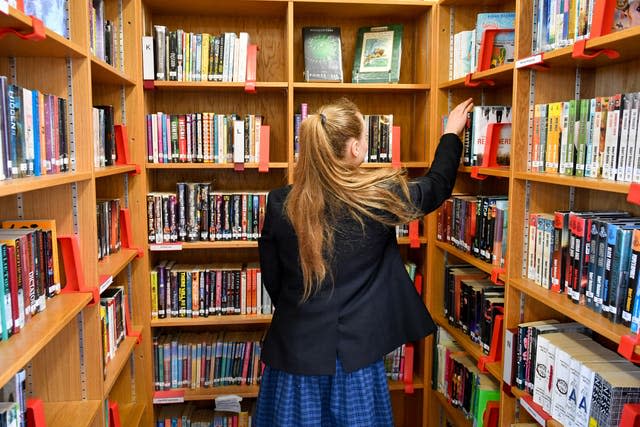 Girl grabbing a book