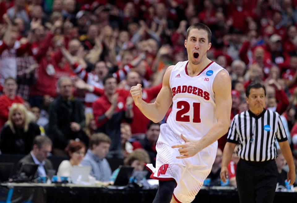 Wisconsin Badgers guard Josh Gasser (21) celebrates in the final minute during Wisconsin's 85-77 win over Oregon during he  third round of the NCAA Men's Basketball Championship between Wisconsin and Oregon at the BMO Harris Bradley Center in Milwaukee, Wisconsin, Saturday, March 22, 2014.