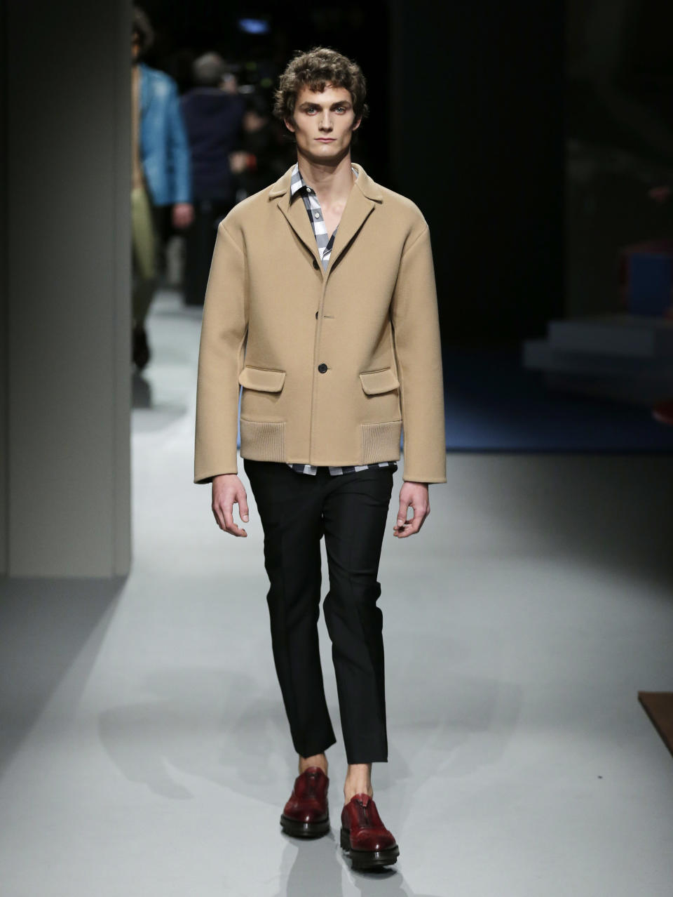 A model wears a creation for Prada men's Fall-Winter 2013-14 collection, part of the Milan Fashion Week, unveiled in Milan, Italy, Sunday, Jan. 13, 2013. (AP Photo/Antonio Calanni)