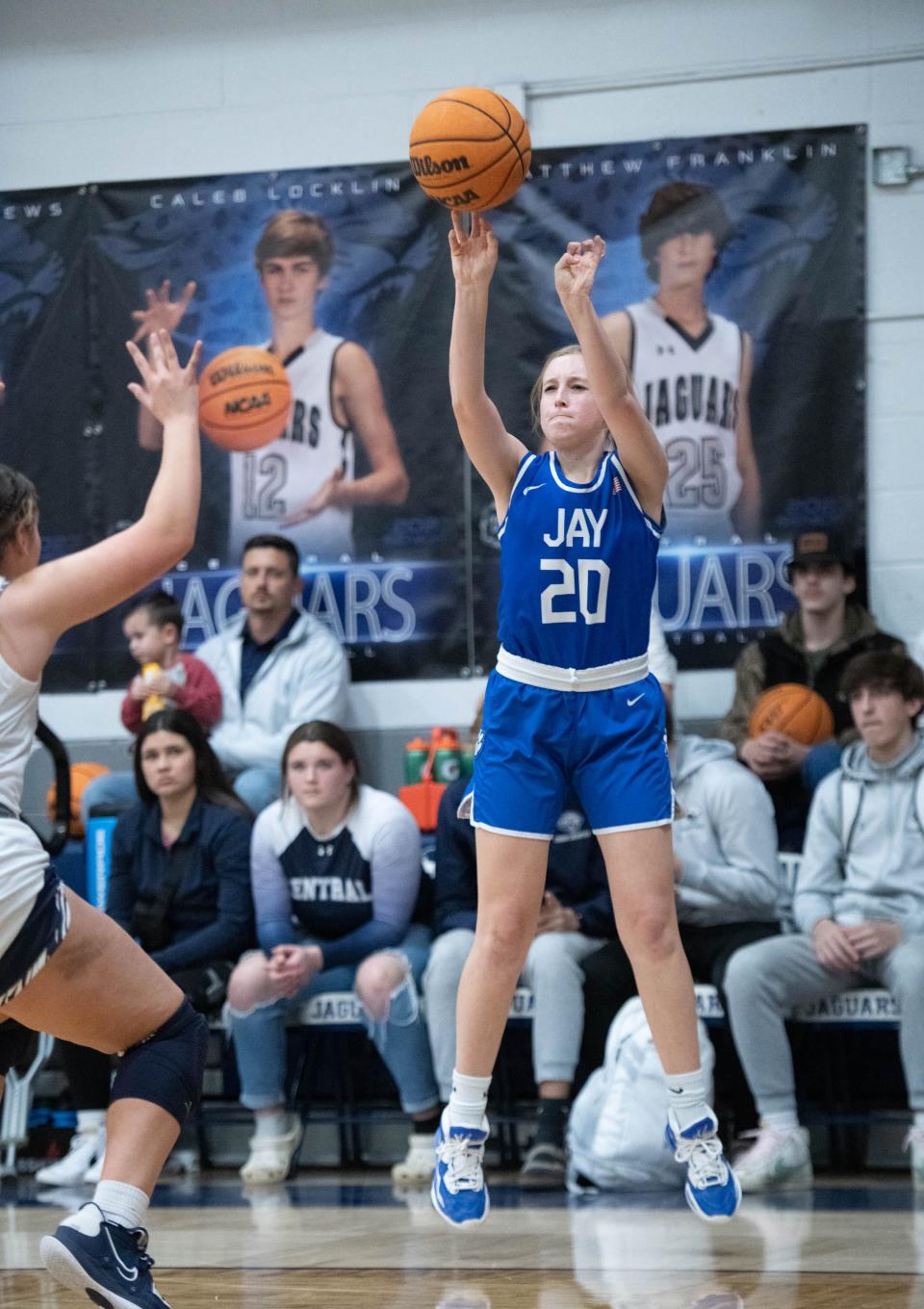 Presley Hawthorne (20) launches and sinks a three-pointer during the Jay vs Central girls basketball game at Central High School in Milton on Friday, Jan. 13, 2023.
