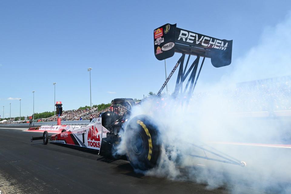 a race car with smoke coming out of it